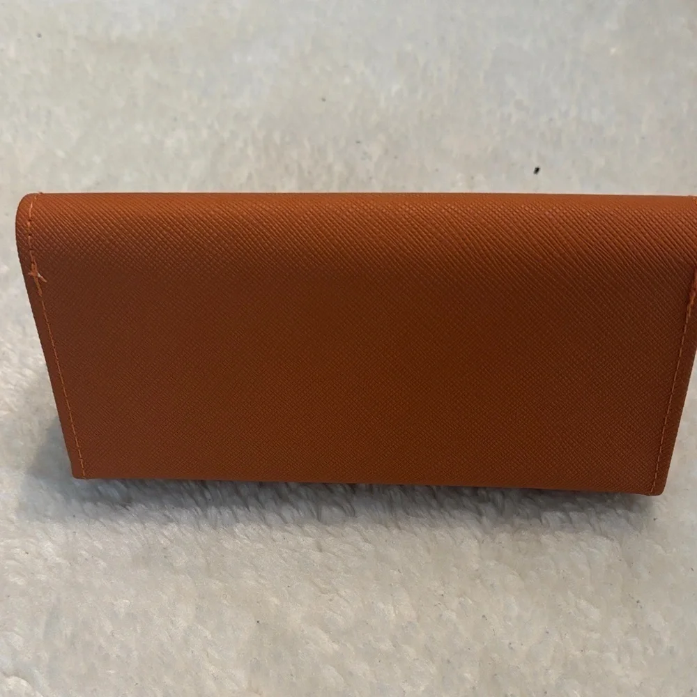 Tory Burch Burnt Orange case of sunglasses
